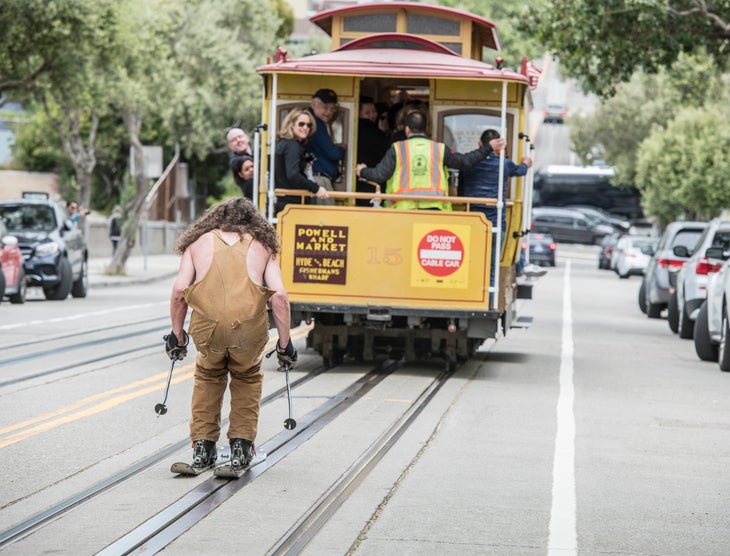 2517_042818_dg_0081 Michael Hibbs skis behind a trolley in San Francisco.
