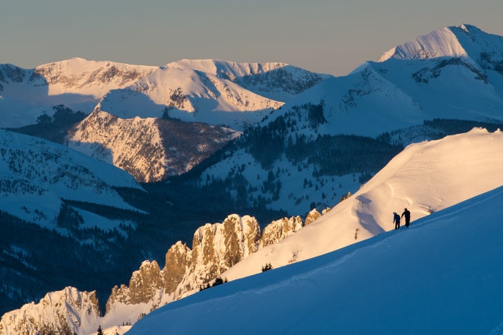 Colorado_ski-12 Two skiers stand on a ridge near Crested Butte, Colo.