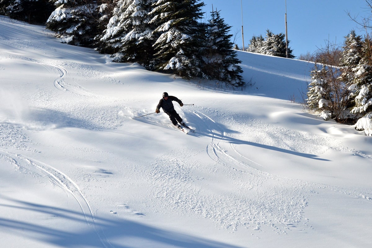 "A skier enjoys fresh snow at Seven Springs Mountain Resort, one of the participating mountains in SkiPA's Snowpass Program"