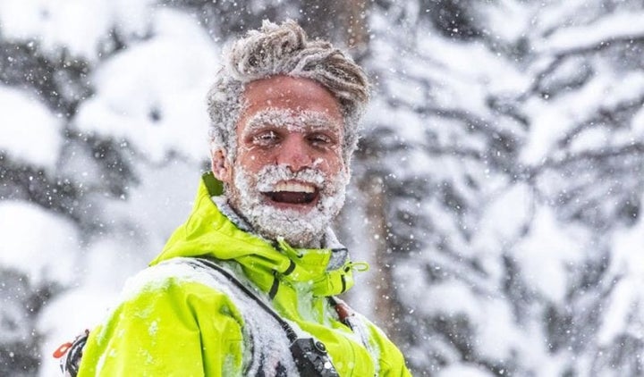 Ryan covered in snow and grinning