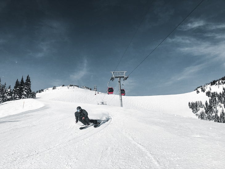skier carving a groomer