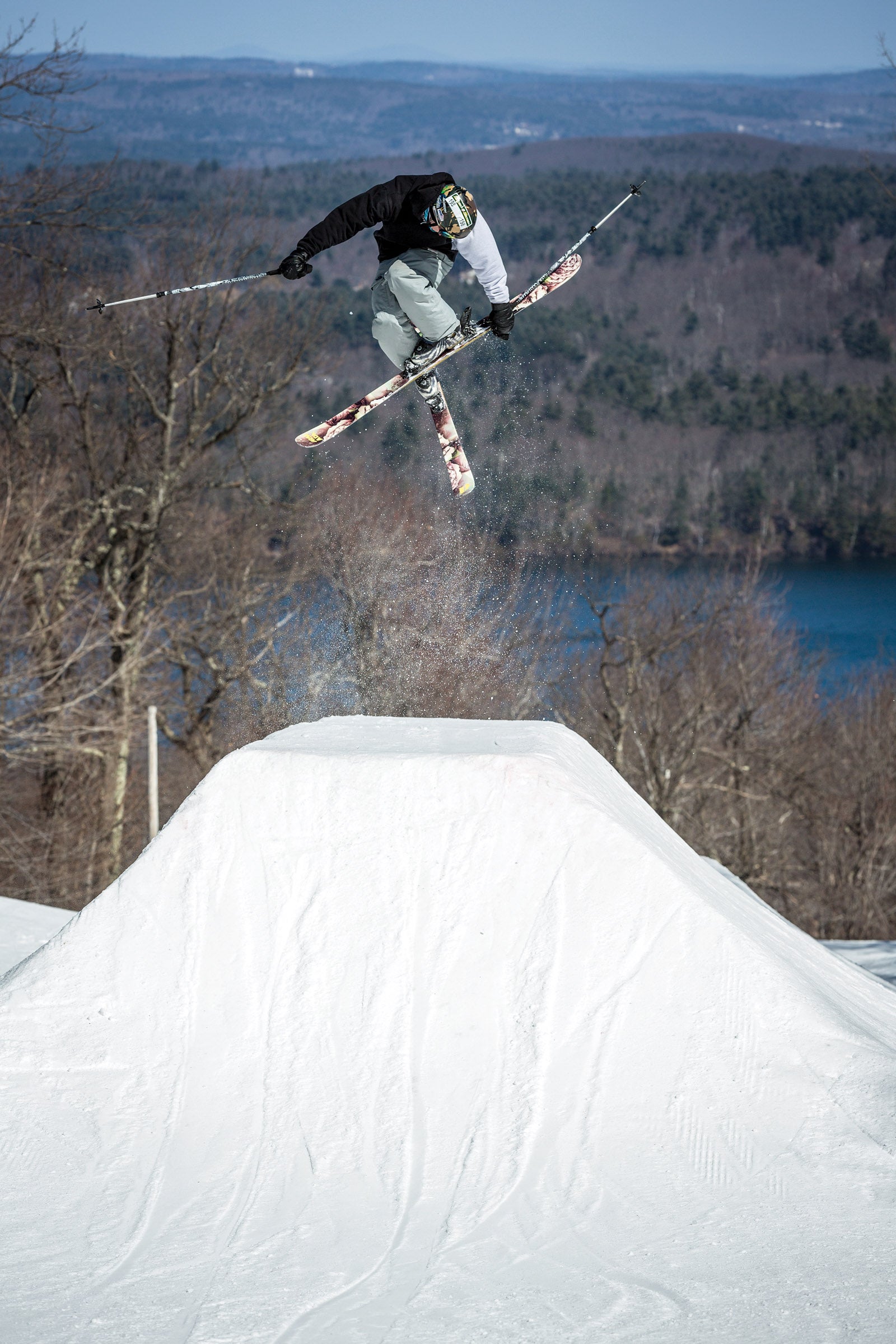 Skier in air with crossed skis