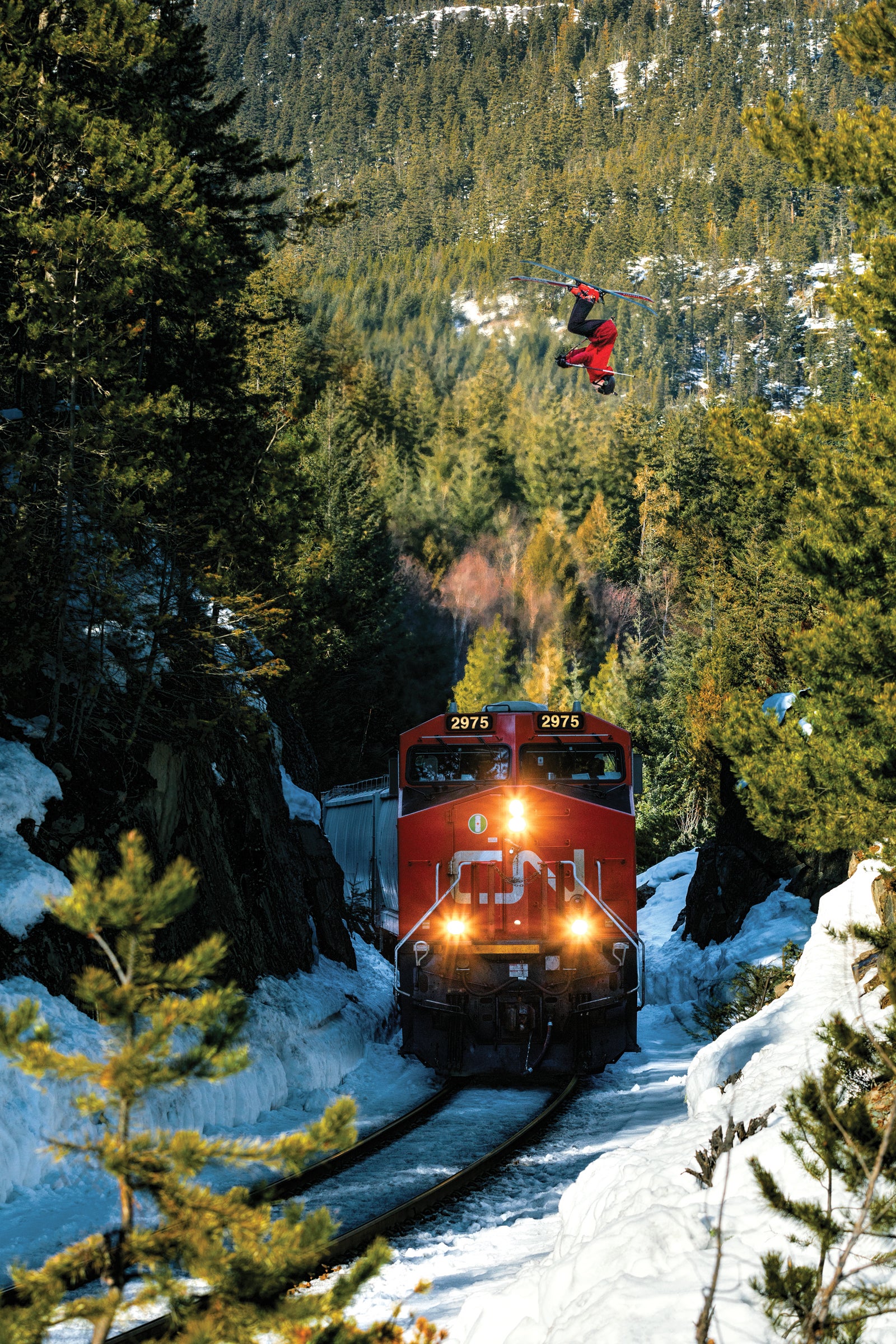 Eli Bucher backflips over a passing train