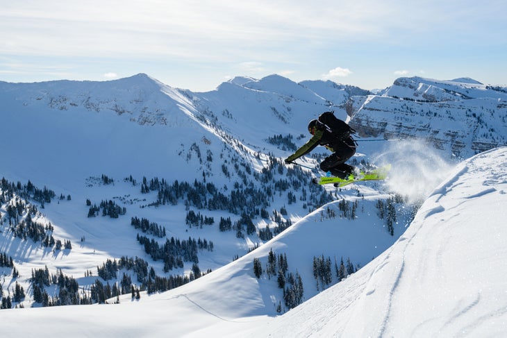 skier catching air on a cornice