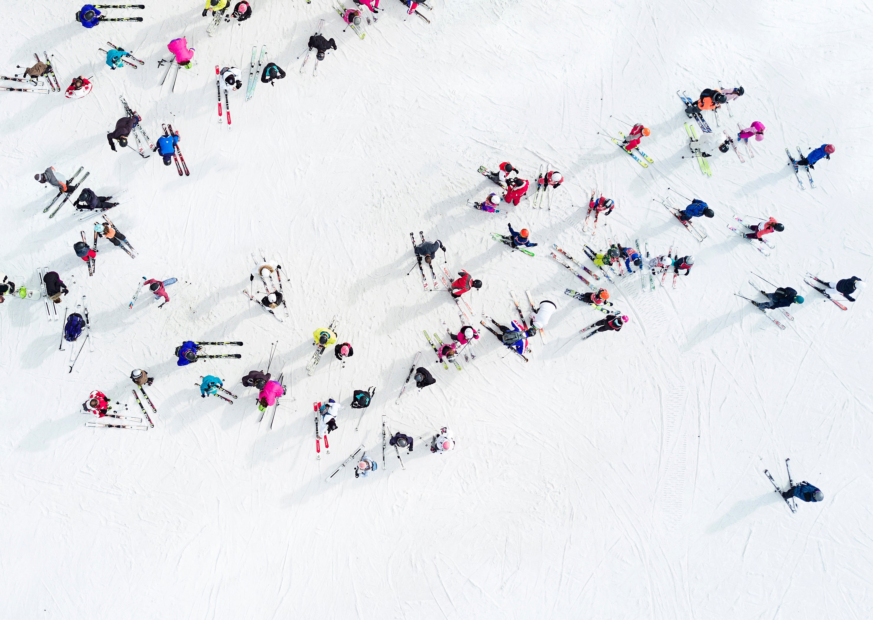 Aerial view of a group of skiers and snowboarders