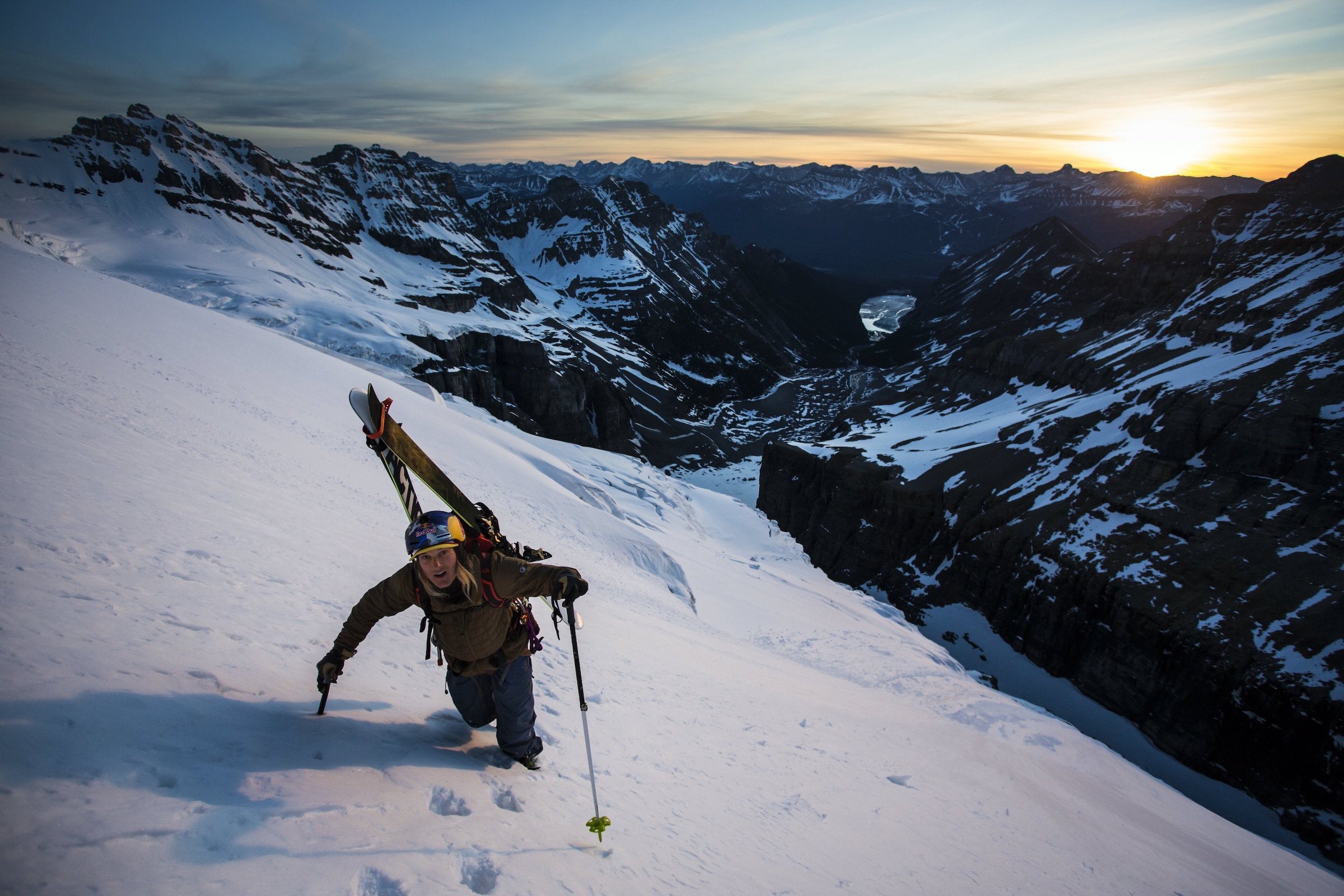 Professional skier Johnny Collinson bootpacks in the snow