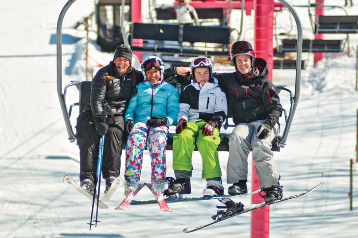 Skiers on chairlift at Schuss Mountain, Michigan