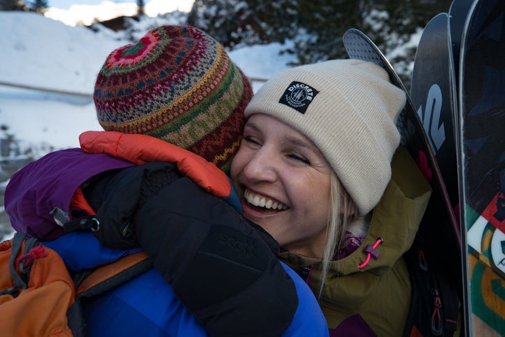 Amie Engerbretson hugs guide Hannes Stähli.