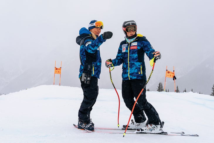 US Ski Team coach Karin Harjo gives an athlete some pointers on the hill