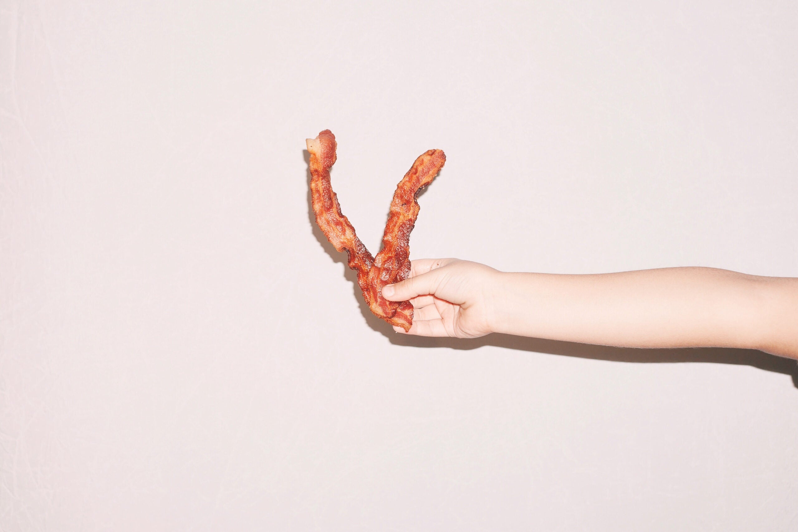 bacon in hand
