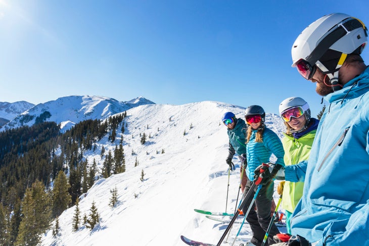 skiers on top of a slope