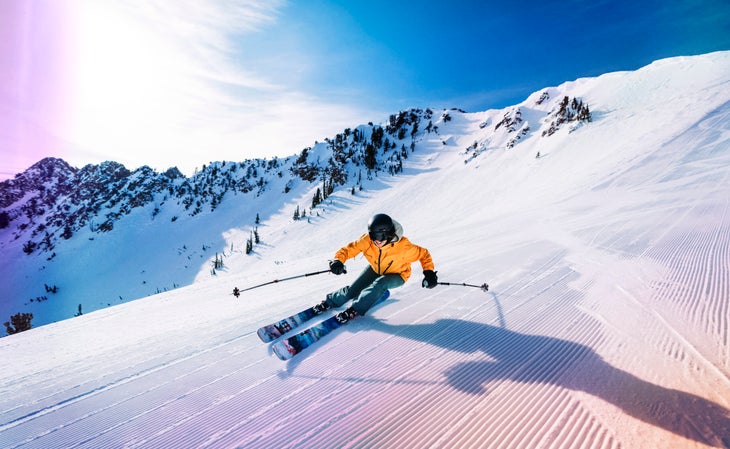 Skier soaking up the sun at Snowbasin.