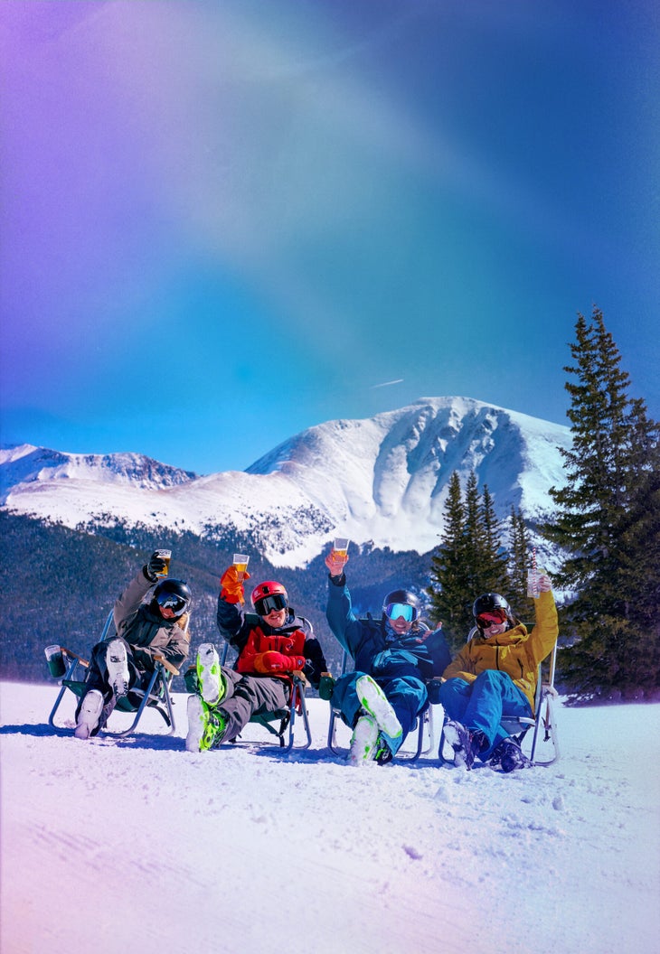 Friends relax after a fun day of skiing in the mountains