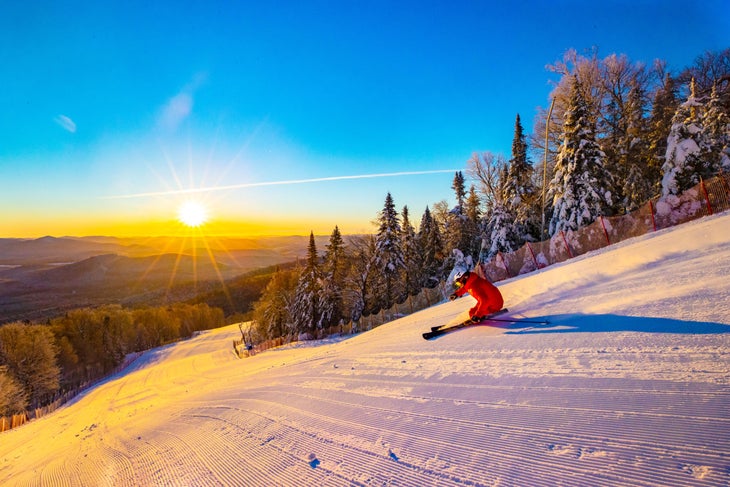 Sunrise skiing in the mountains