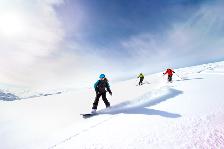 three people skiing