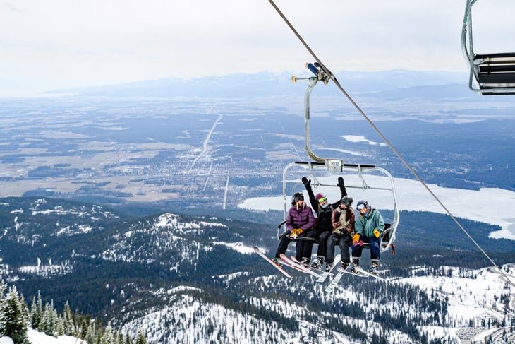 Skiers on chairlift at Whitefish Mountain