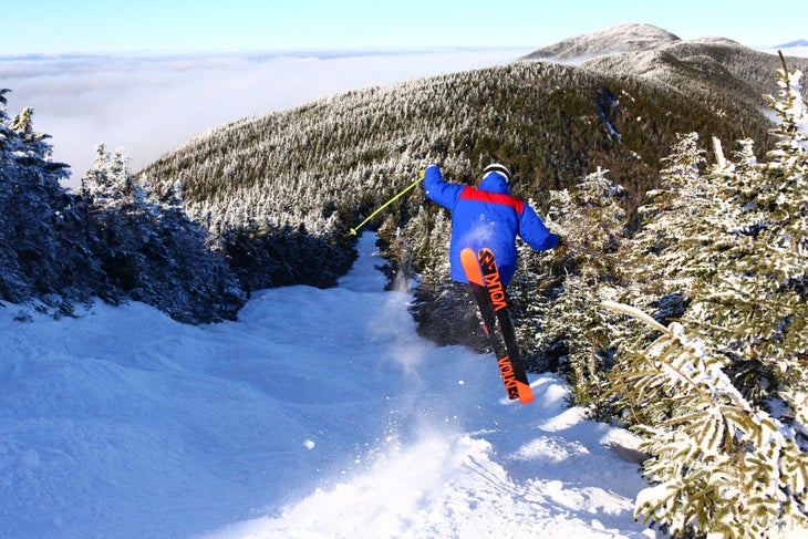 Skier jumping on Sugarbush ski run
