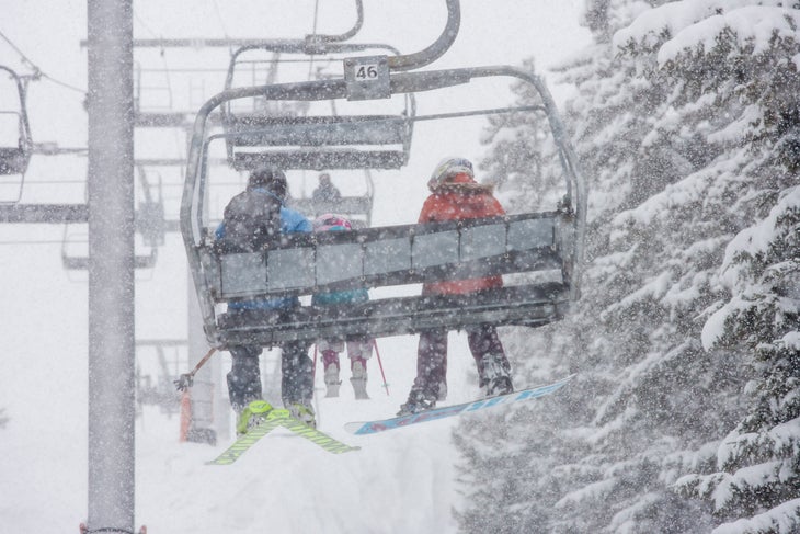 Skiers on chairlift Sunday River