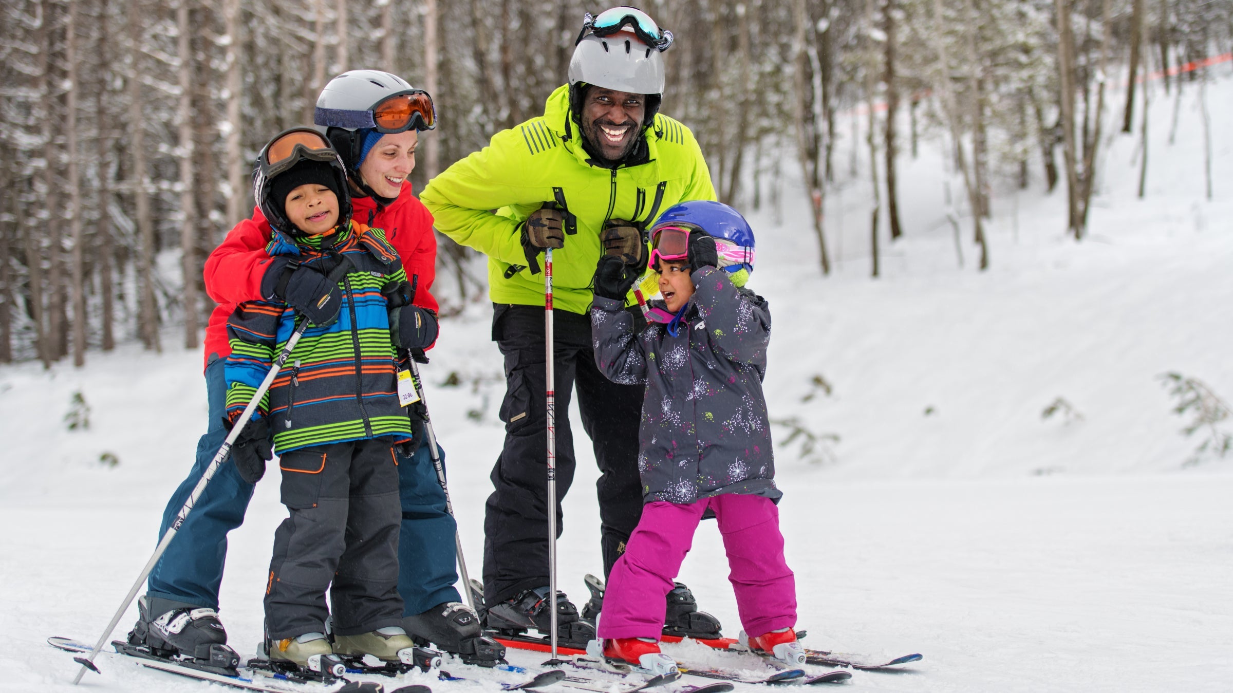 A family of four skiing