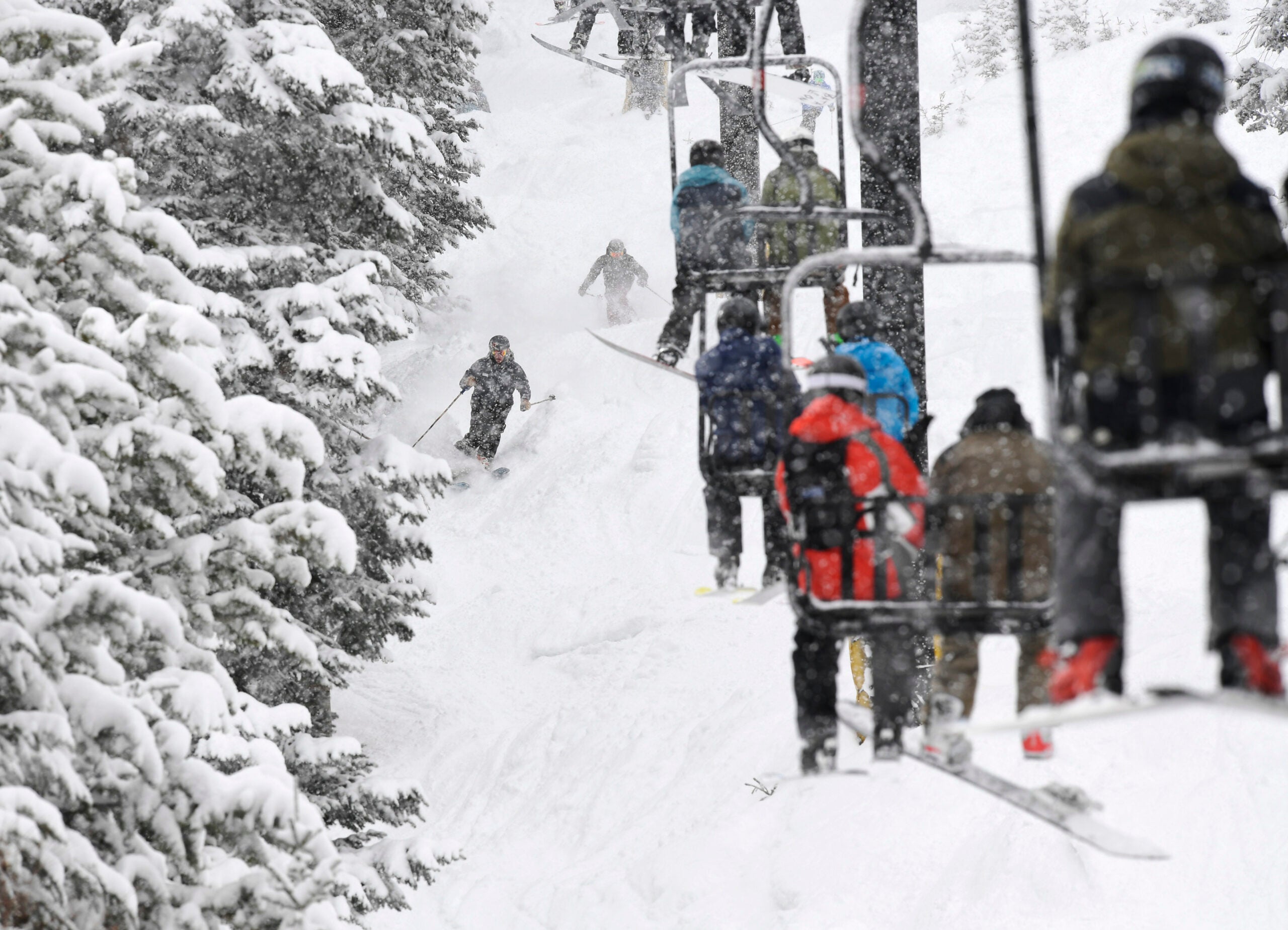 Skiers negotiate 10-inches of fresh powder on underneath the Challenger lift at Winter Park. That's hard to do hungover.