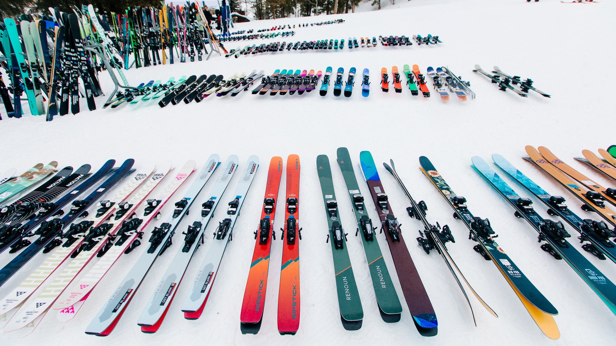 Lots of colorful skis lined up on snow during SKI's annual ski test
