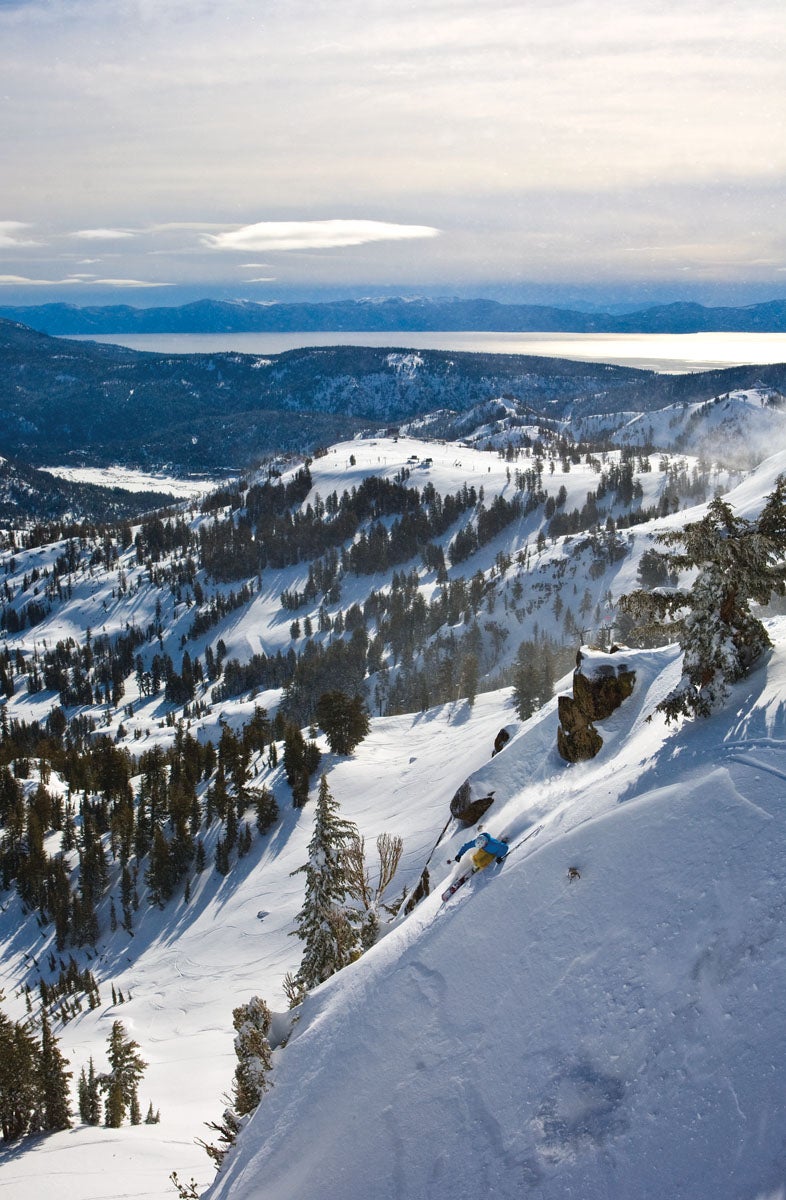 SKI1117_SQUAW06_byRyanSalm Rylan Cordova lays tracks with Lake Tahoe shimmering in the background