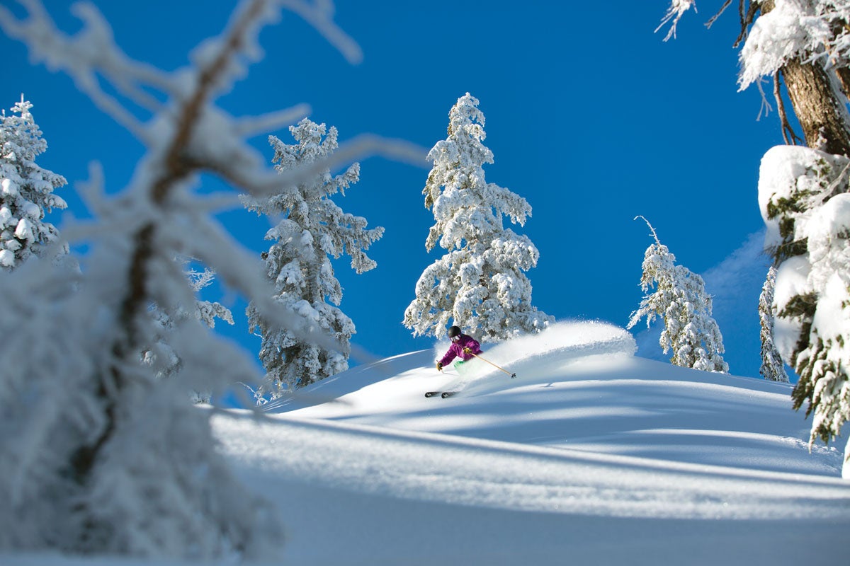SKI1117_SQUAW07_byRyanSalm A bluebird sky and plenty o’ pow make Robin McElroy a happy girl.