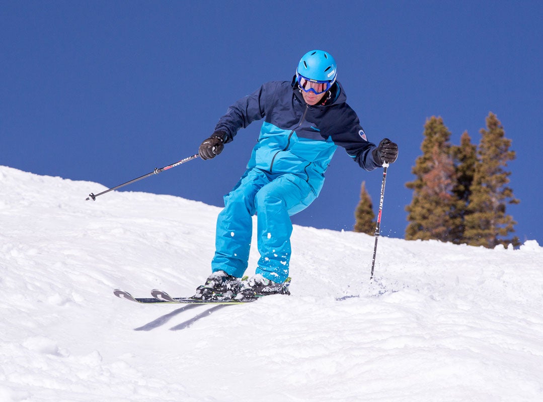 Michael Rogan demonstrates pole plant while skiing bumps.