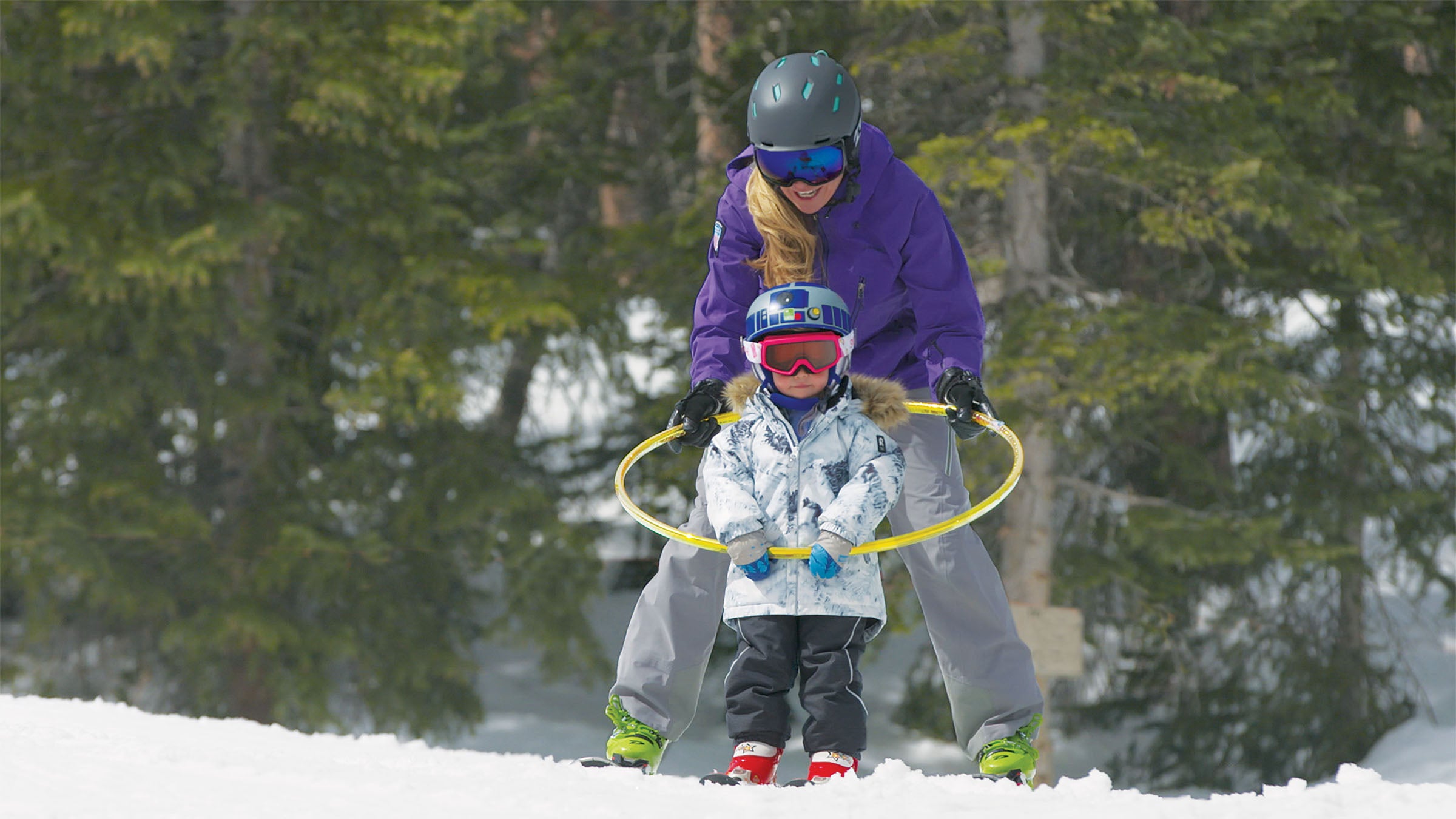 SKI1119-CLI-byBaileyLaRue_1 A mother teaching her child how to ski.