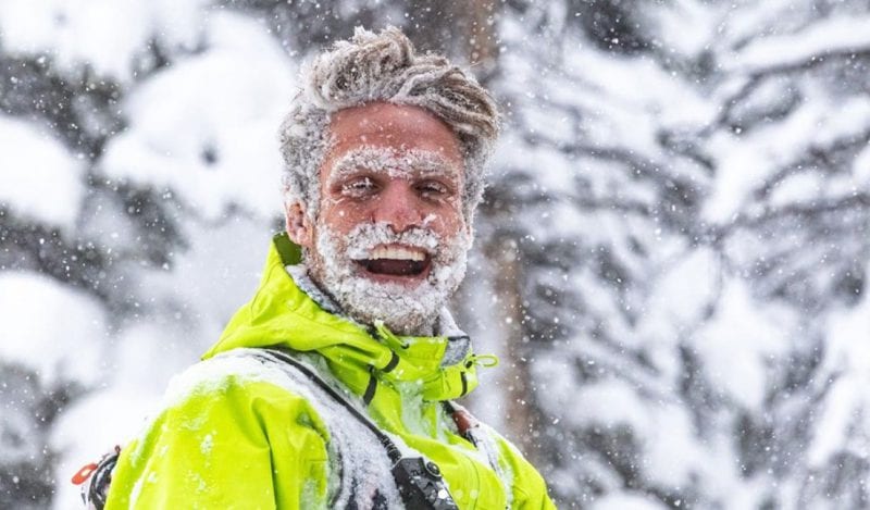 Ryan covered in snow and grinning