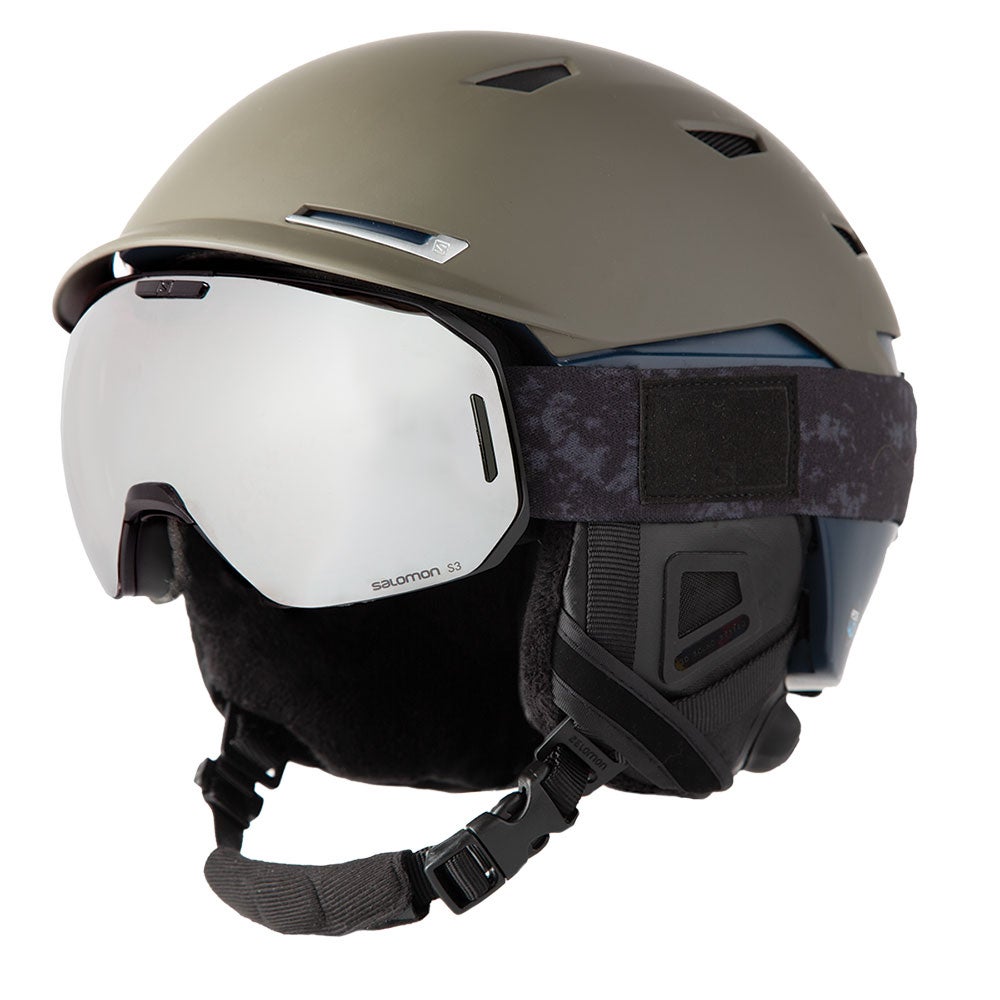 White and black goggles with brown helmet