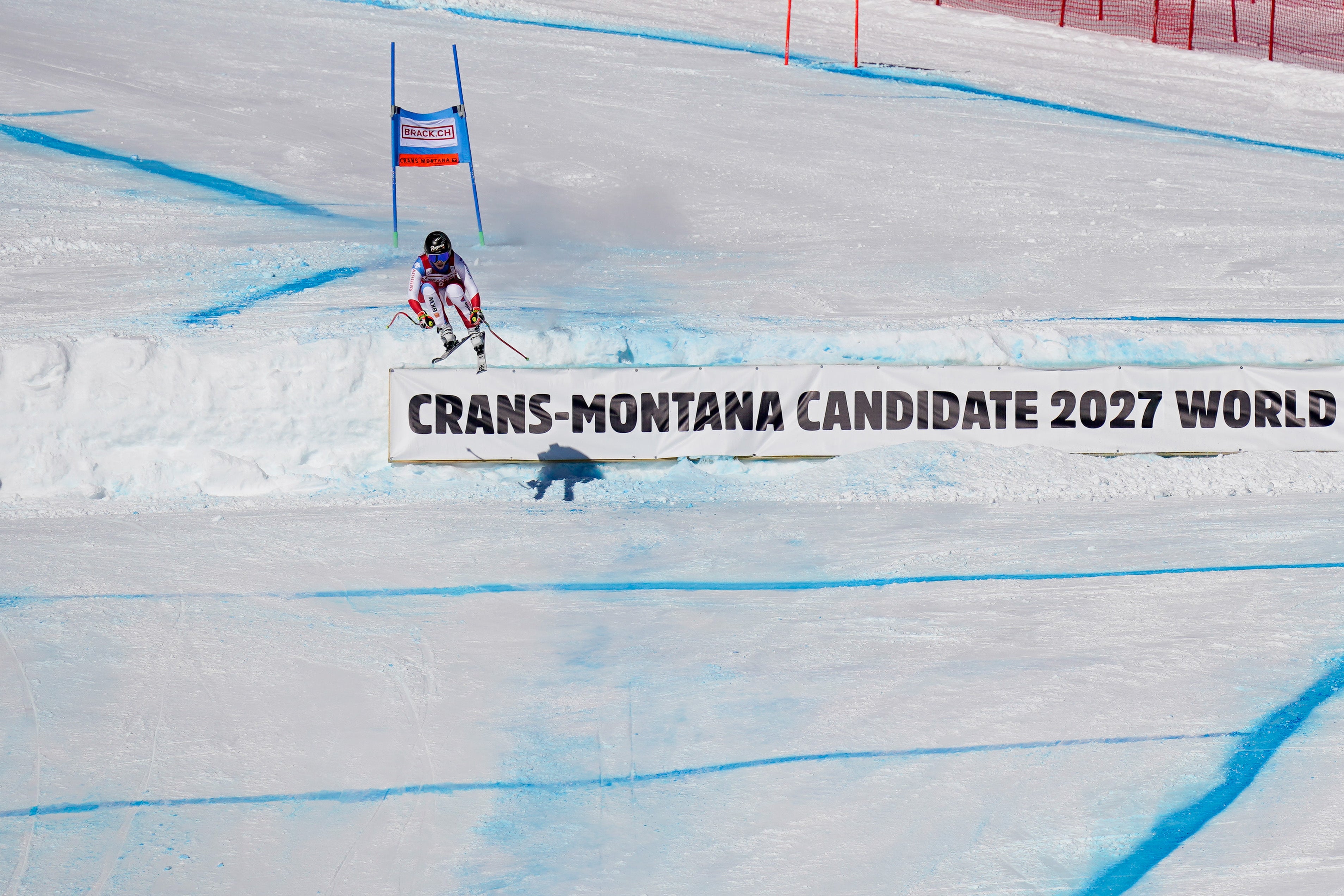 Lara Gut-Behrami is airborne on the final jump of Crans Montana downhill