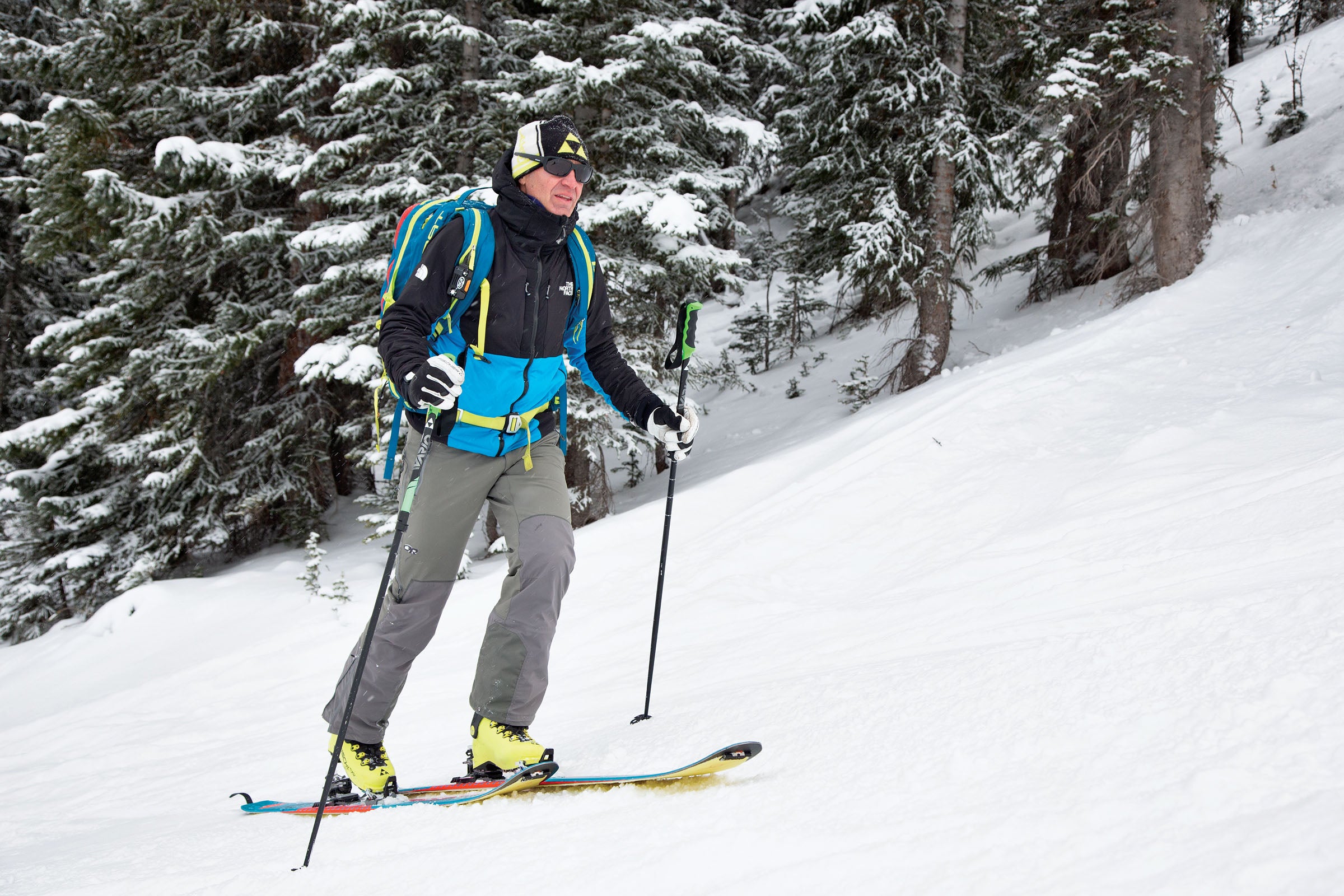 Skier touring up a slope correctly.